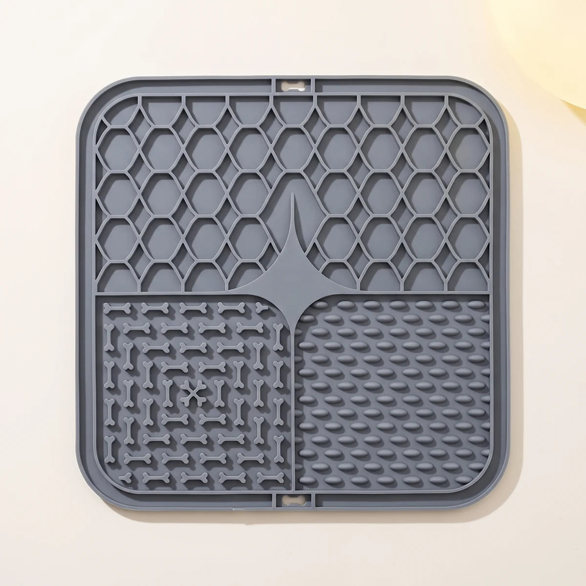 The grey lick mat with its three raised zones