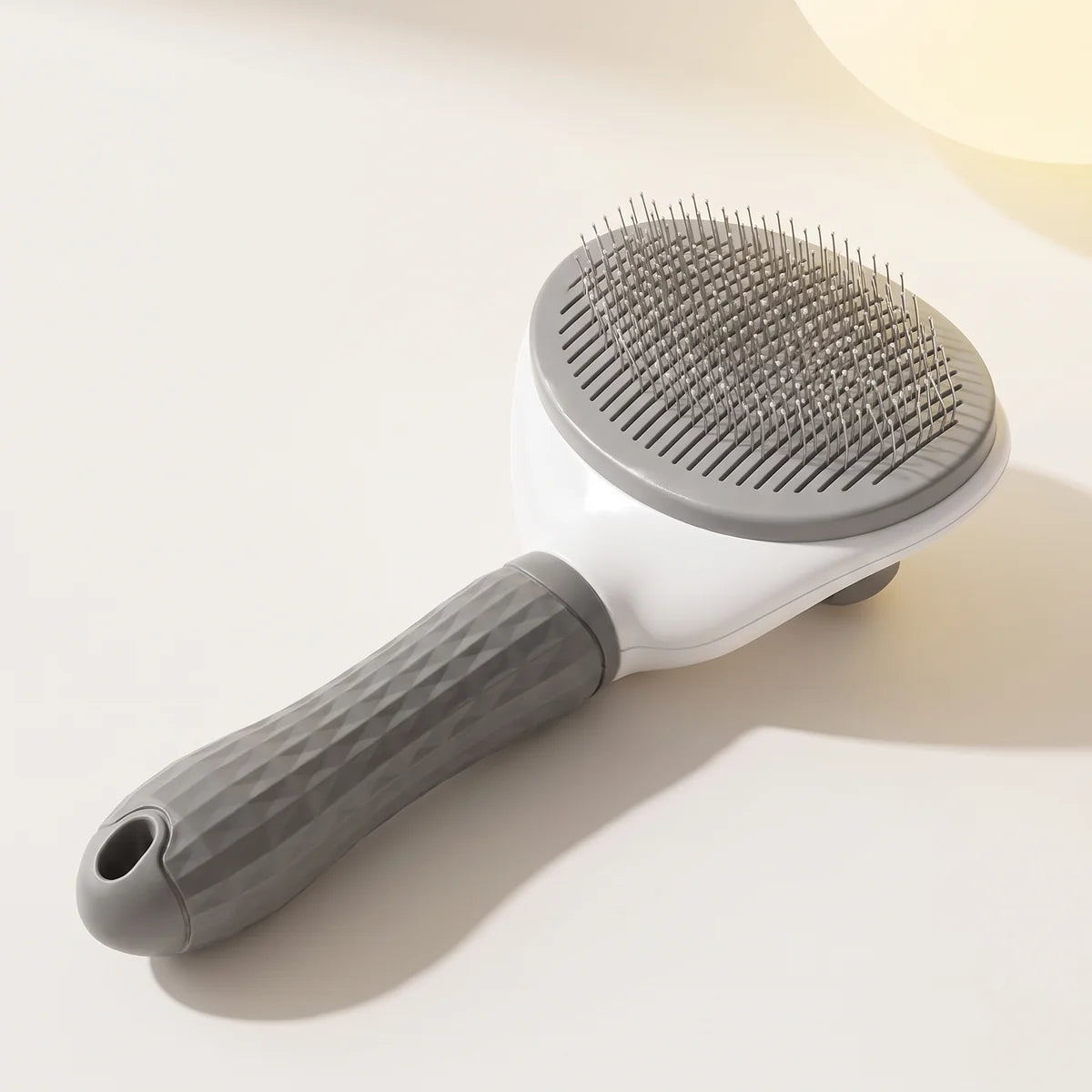 The self-cleaning slicker brush, grey head and handle