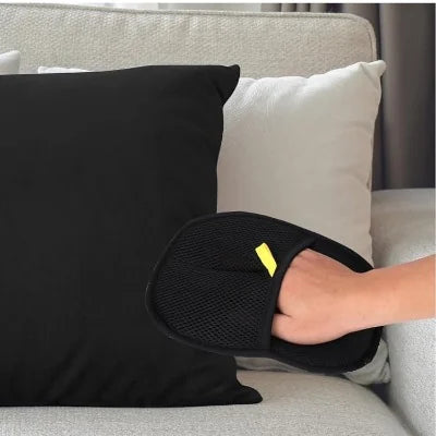 A hand in the glove on a black cushion
